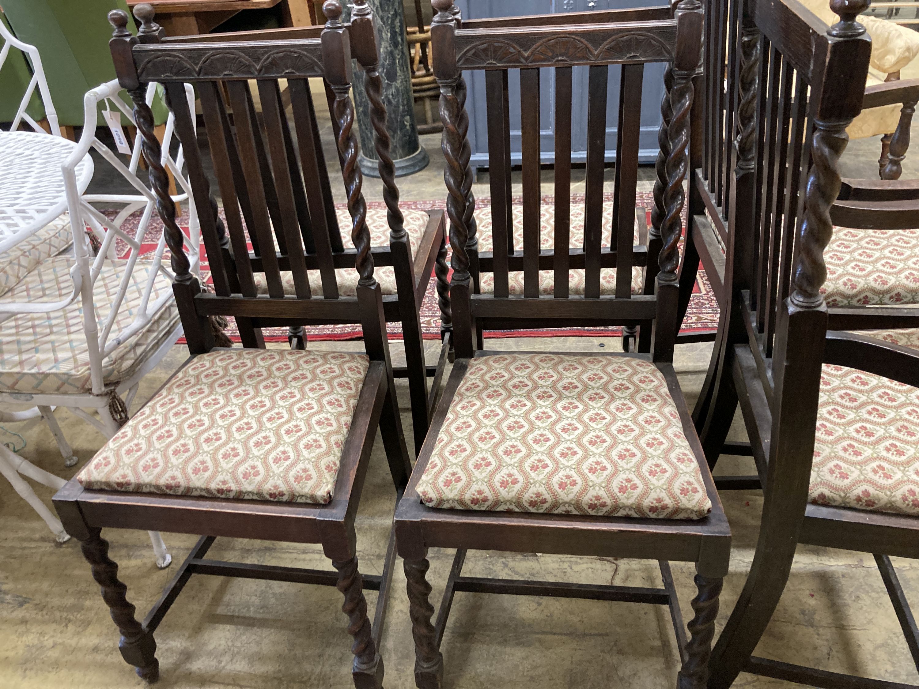 A set of six 1920's oak barleytwist dining chairs, two with arms